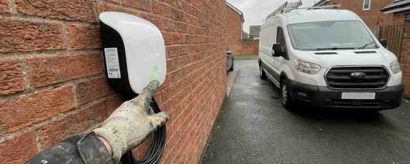 Home EV charger installed on exterior wall